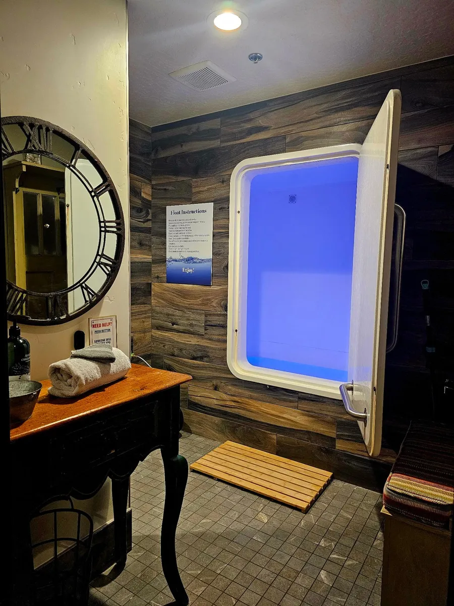 The float tank room, with its glowing blue pod